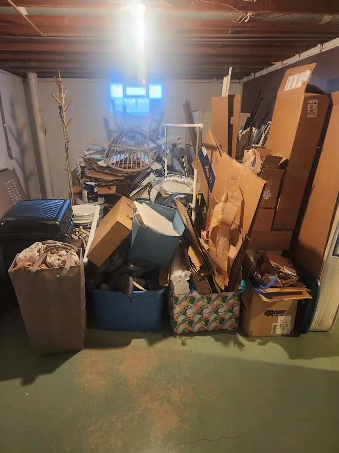 Roll-off dumpster container at job site for 2 Yard Dumpster Rental in Devils Lake